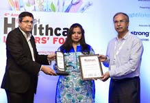 Manorama Infosolution CEO Ashvini Danigond receiving award at Healthcare Leaders Forum Awards