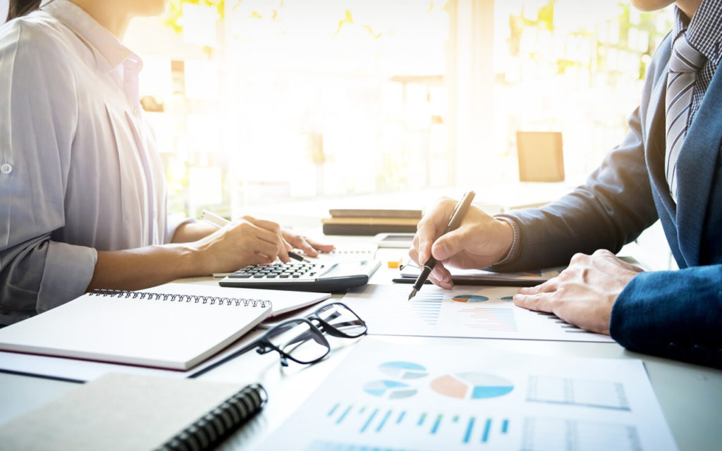 Men and women discussing business process management