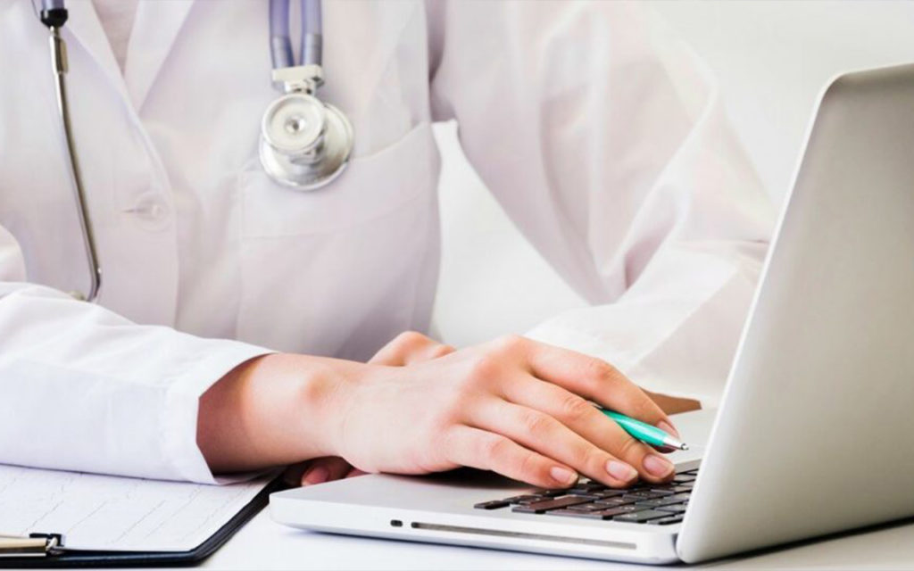 Doctor is making digital documentation